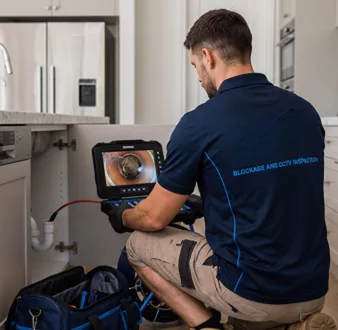 Clearing a blocked sink at a Middle Dural property